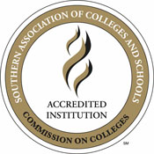 The image shows the official seal of the Southern Association of Colleges and Schools Commission on Colleges, featuring the text "Accredited Institution" in the center, surrounded by a circular band with the organization's name, symbolizing their rigorous accreditations and approvals.