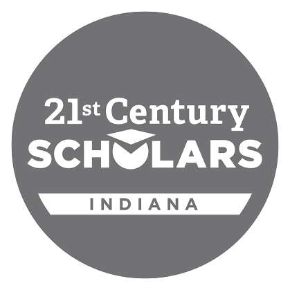 A circular logo with a gray background and white border reading "21st Century Scholars" in bold, white letters. The word "Indiana" is written below in a white ribbon-like shape.